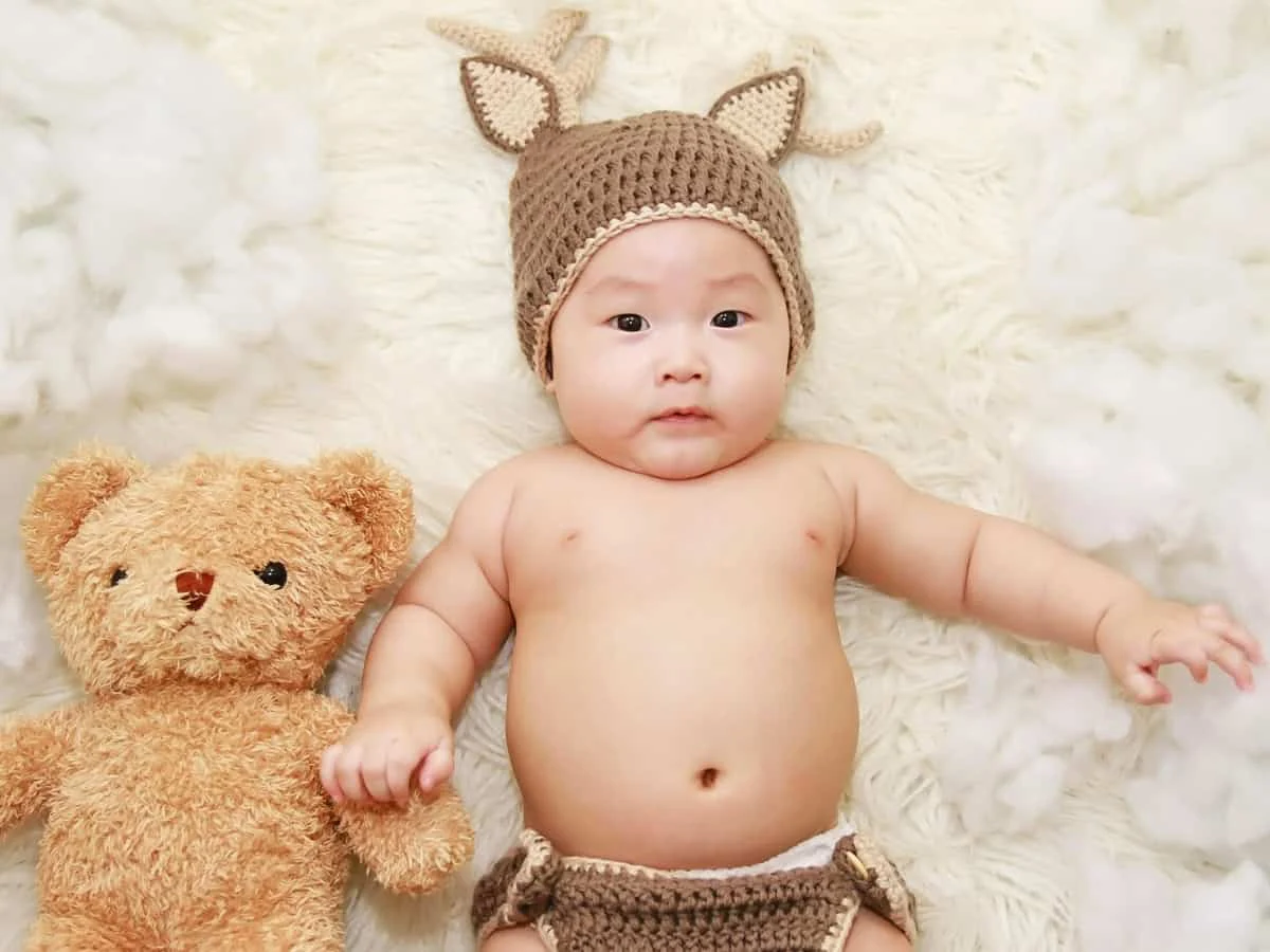 Baby portrait with teddy retouching after