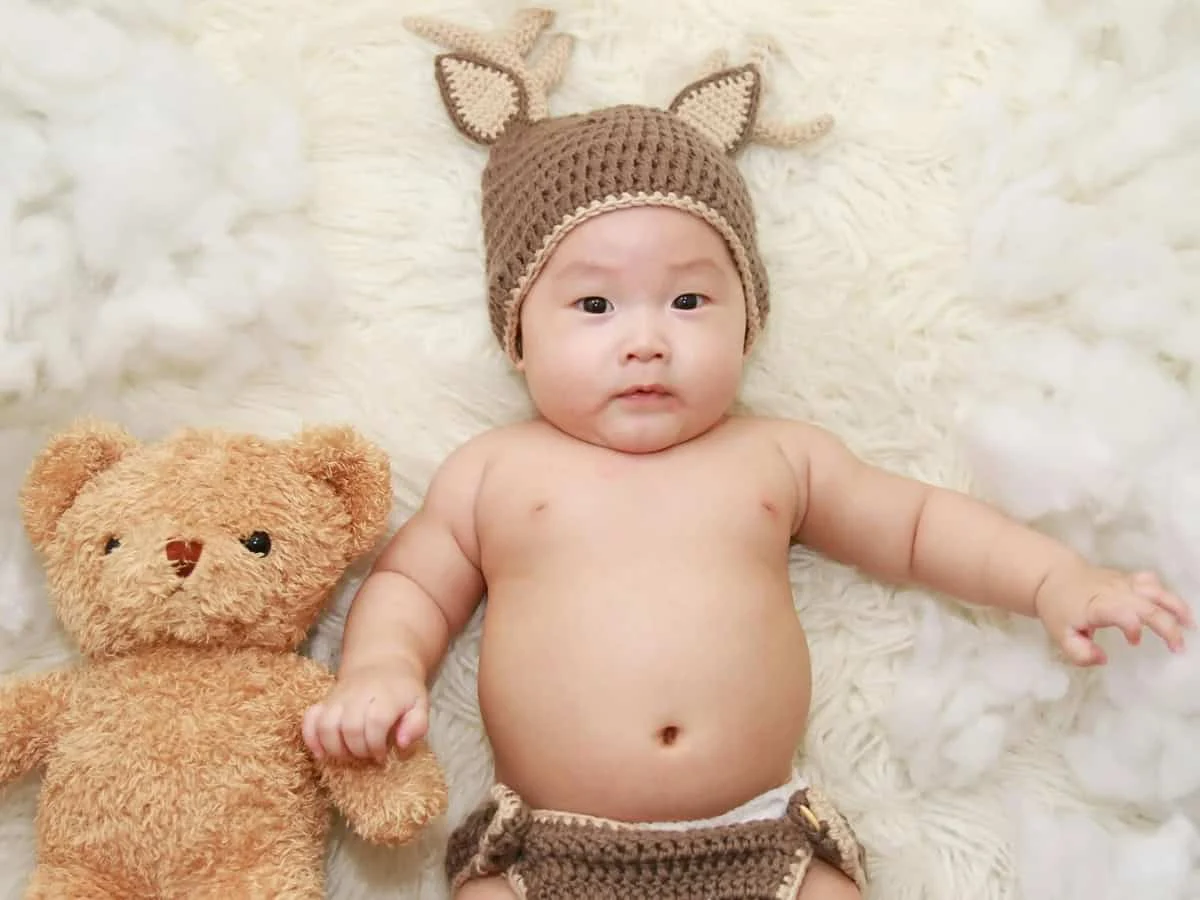 Baby portrait with teddy retouching before